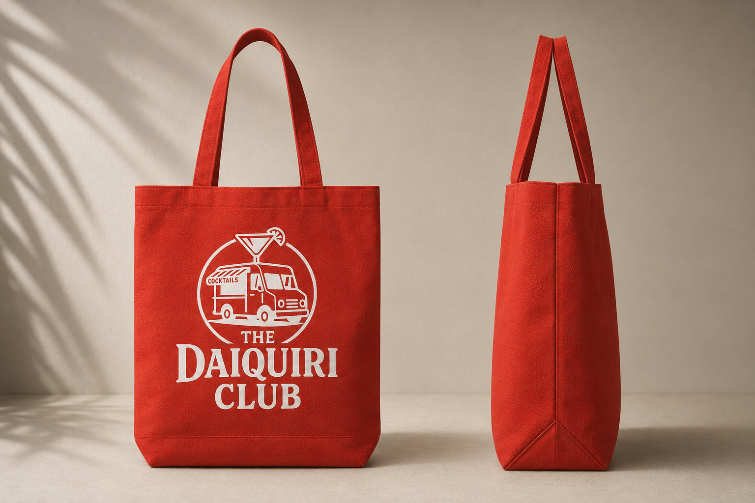 The Daiquiri Club red canvas tote bag with white logo