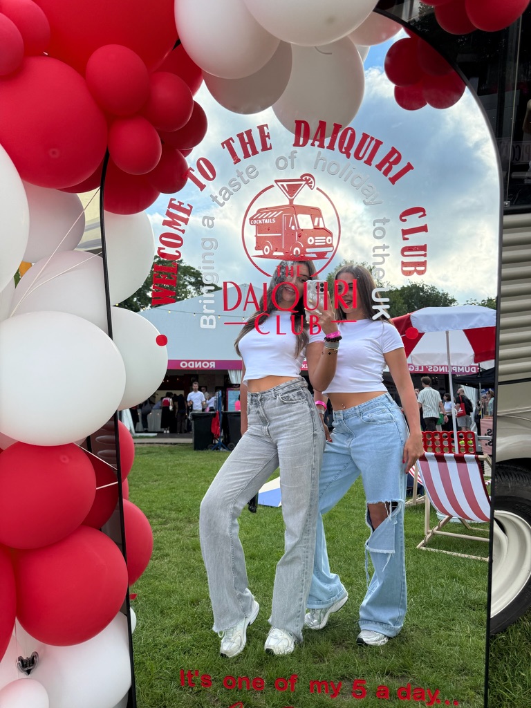 Welcome to The Daiquiri Club signage with balloon arch